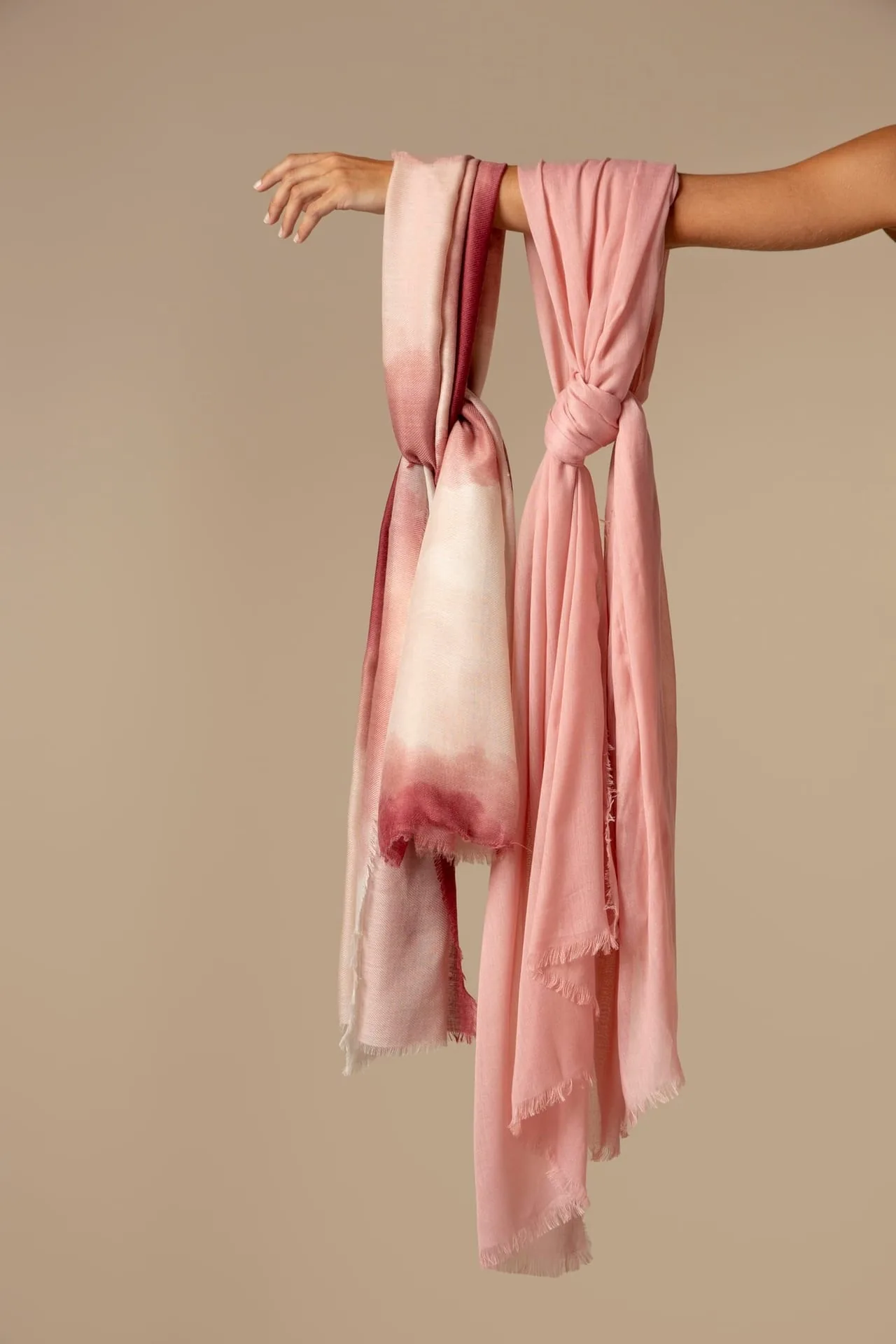 Lightweight silk scarf draped softly, showing its translucent weave