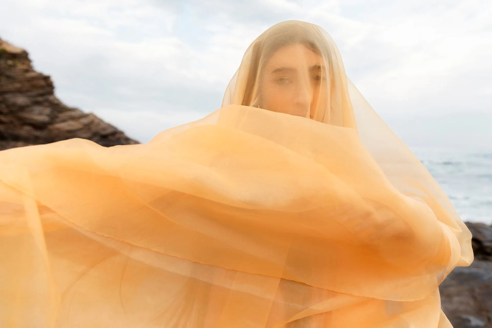 Soft folds of silk fabric catching gentle light
